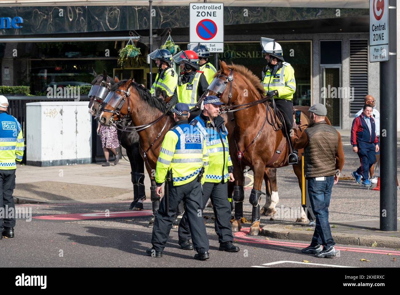 Mounted police policing a Democratic Football Lads Alliance, DFLA, march towards Parliament, London, UK, in a protest demonstration against terrorism. Stock Photo