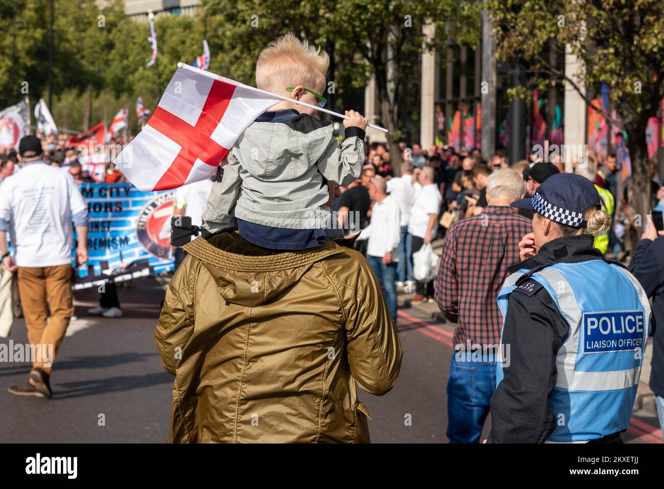 Young boy on a Democratic Football Lads Alliance, DFLA, march towards Parliament, London, UK, in a protest demonstration against terrorism. Police Stock Photo