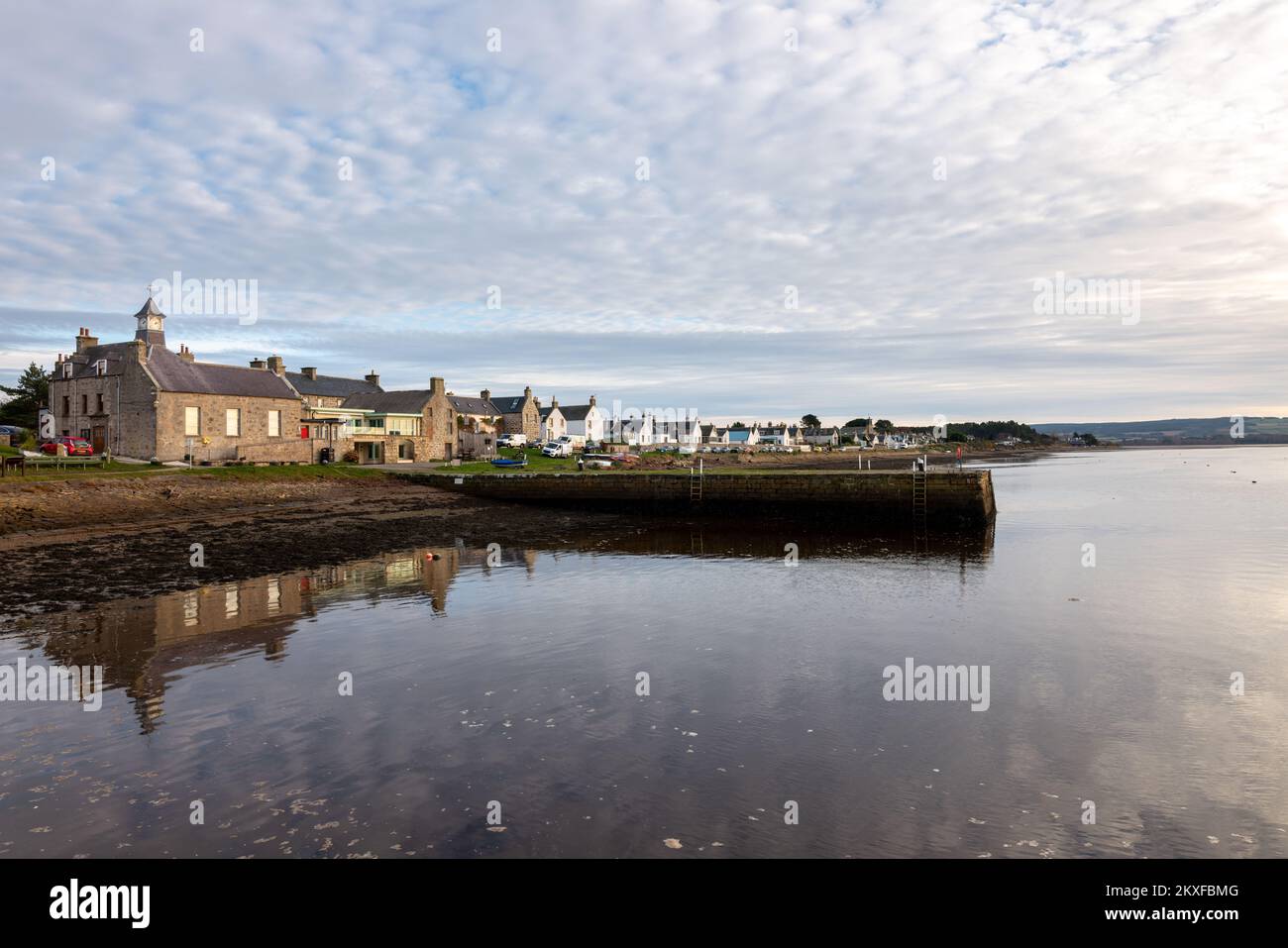 30 November 2022. Findhorn,Moray,Scotland. This is the buildings in the small village of Findhorn being reflected on the bays water. Stock Photo