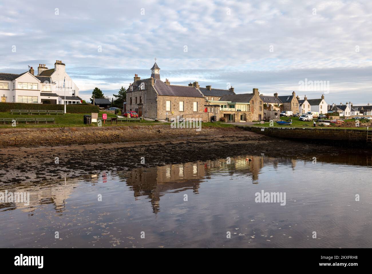 30 November 2022. Findhorn,Moray,Scotland. This is the Buildings on the beach of the bay being reflected on the water in the sea. Stock Photo