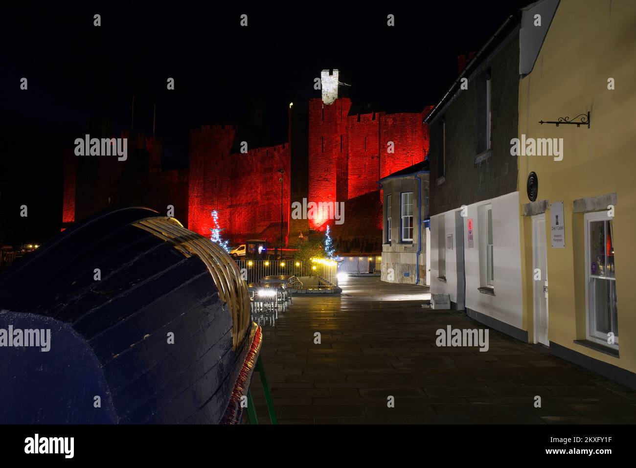 Cwrt Celf with Caernarfon Castle, illuminated red to commemorate Wales