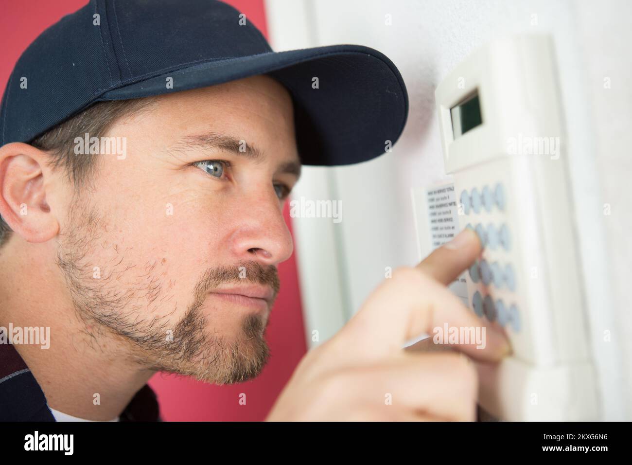 installing a programmable room thermostat Stock Photo Alamy