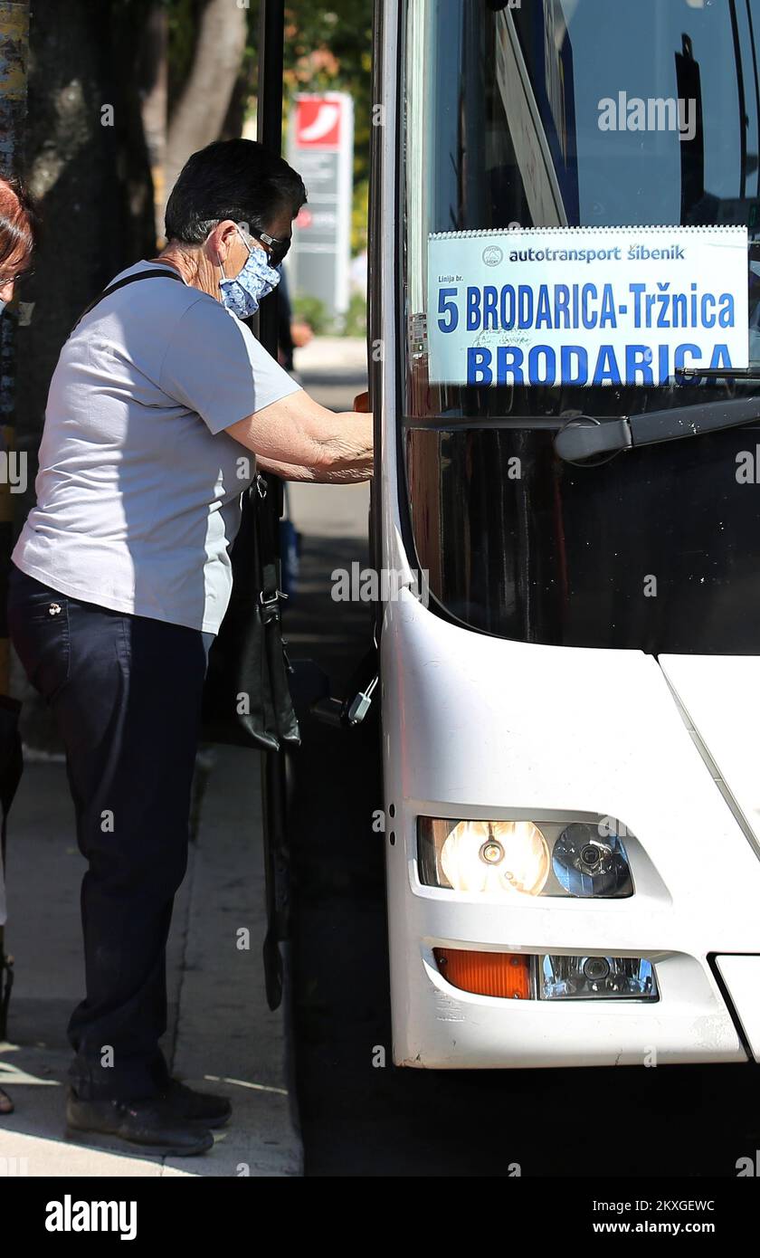 People are pictured wearing medical masks as they use public transport in Sibenik, Croatia on