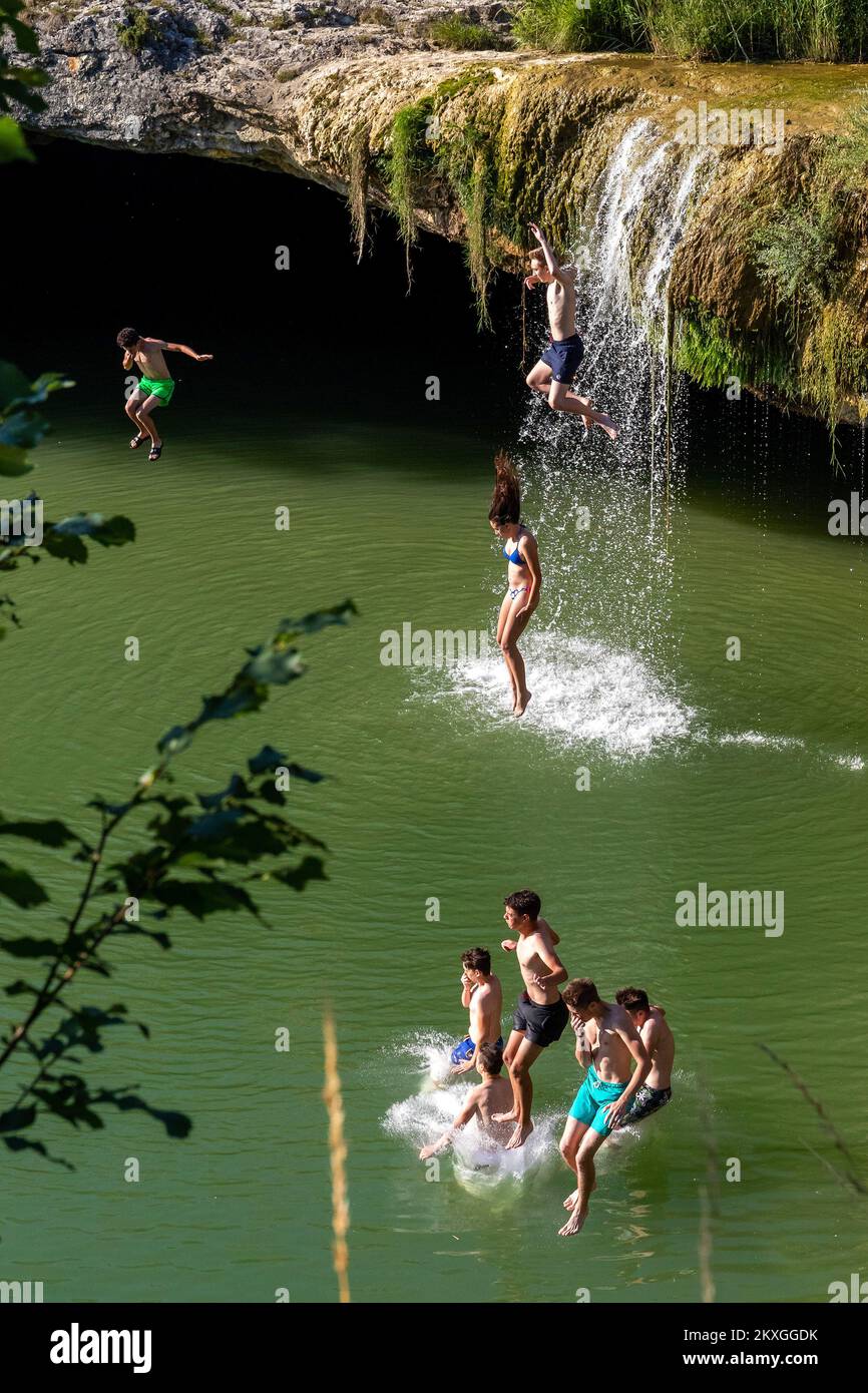 People Falling In Water Hole