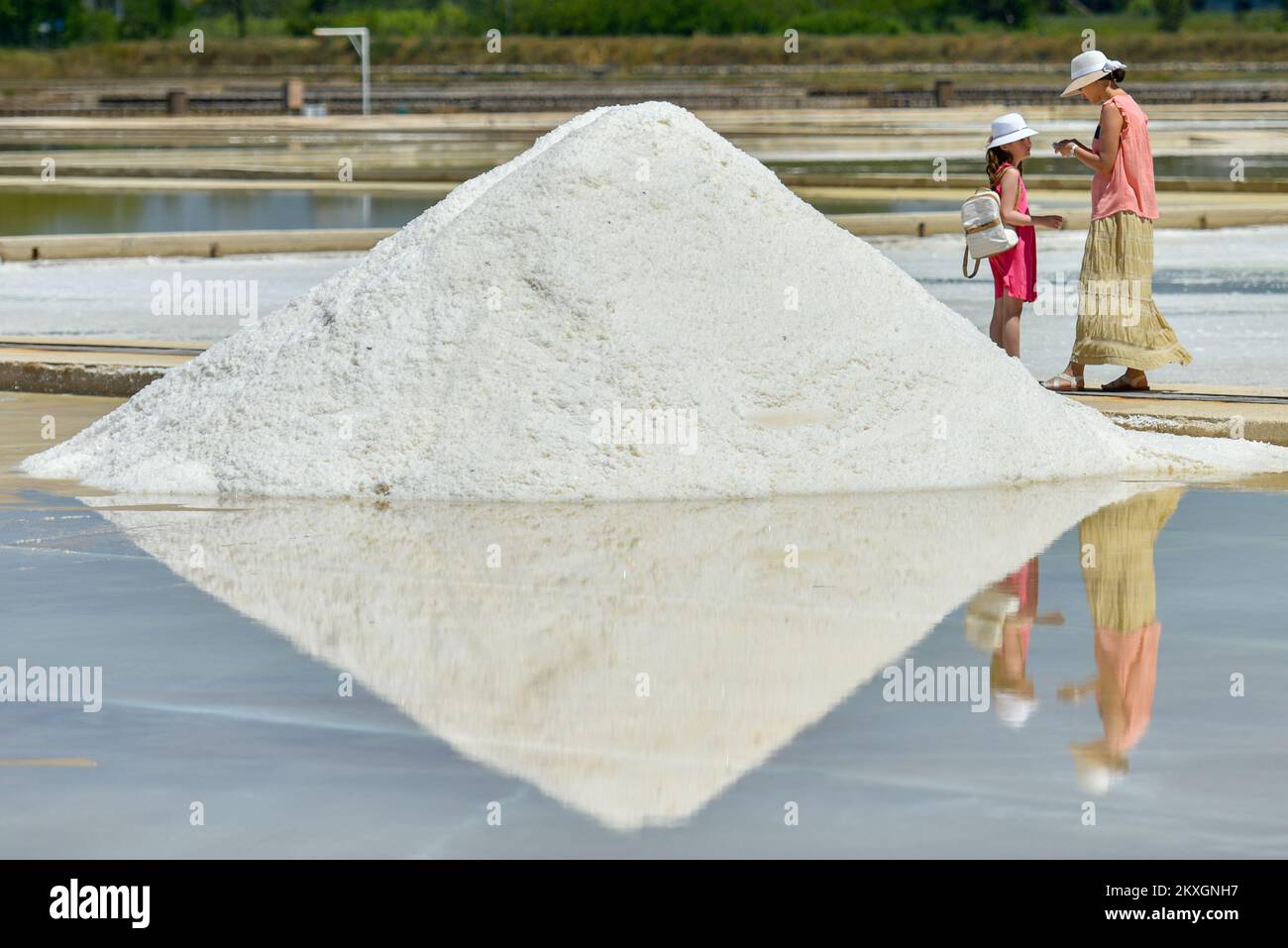 People visit Nin Saltworks in Nin, Croatia, on July 9, 2020. The Saltworks  in Nin, located in the Zadar region, where all of the town's saltwork is  still done traditionally and by