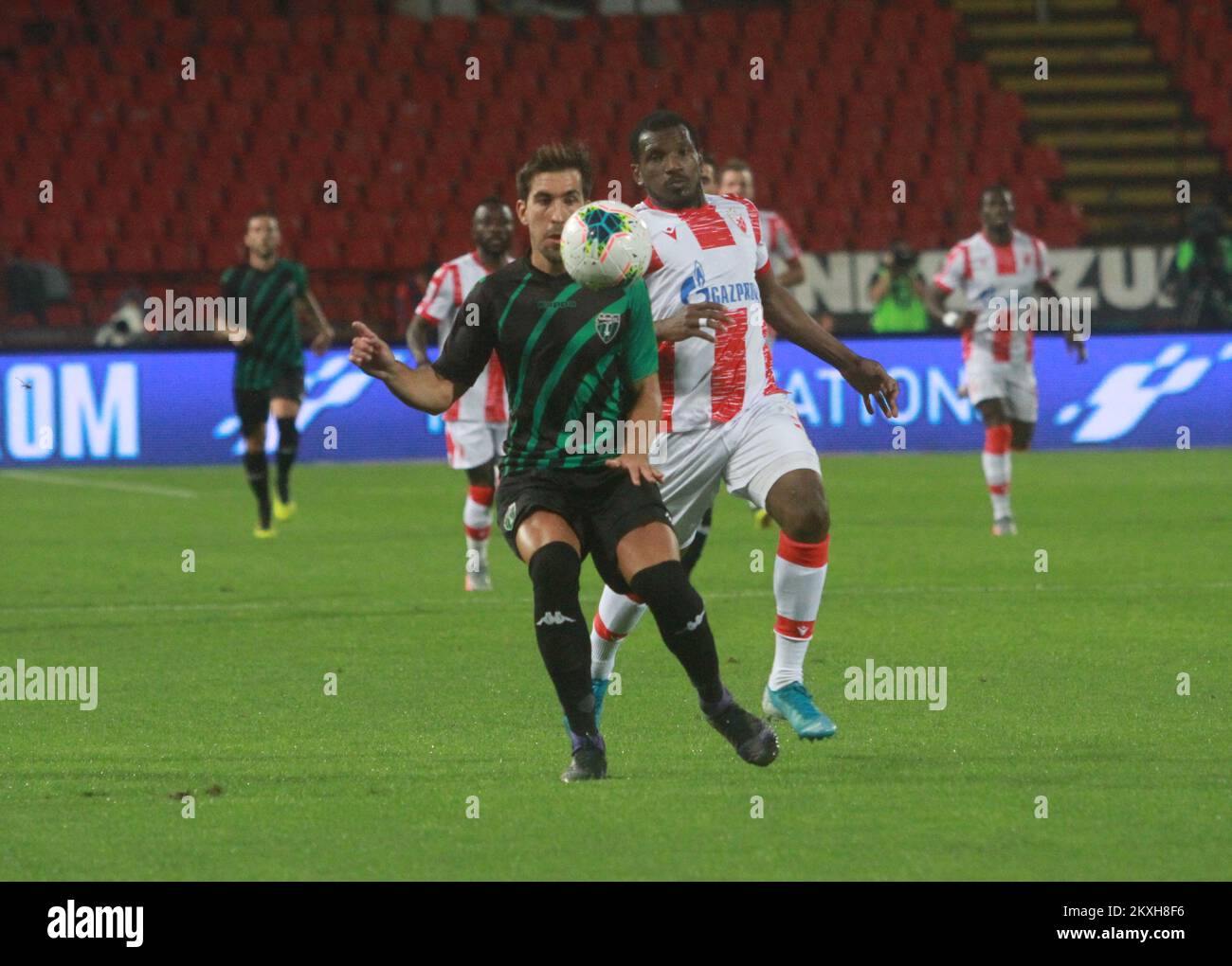 Belgrade, Serbia. 18th Sep, 2018. Crvena Zvezda's El Fardou Ben Nabouhane  (R) vies with Napoli's Raul Albiol during a UEFA Champions League group C  match between Crvena Zvezda and Napoli in Belgrade