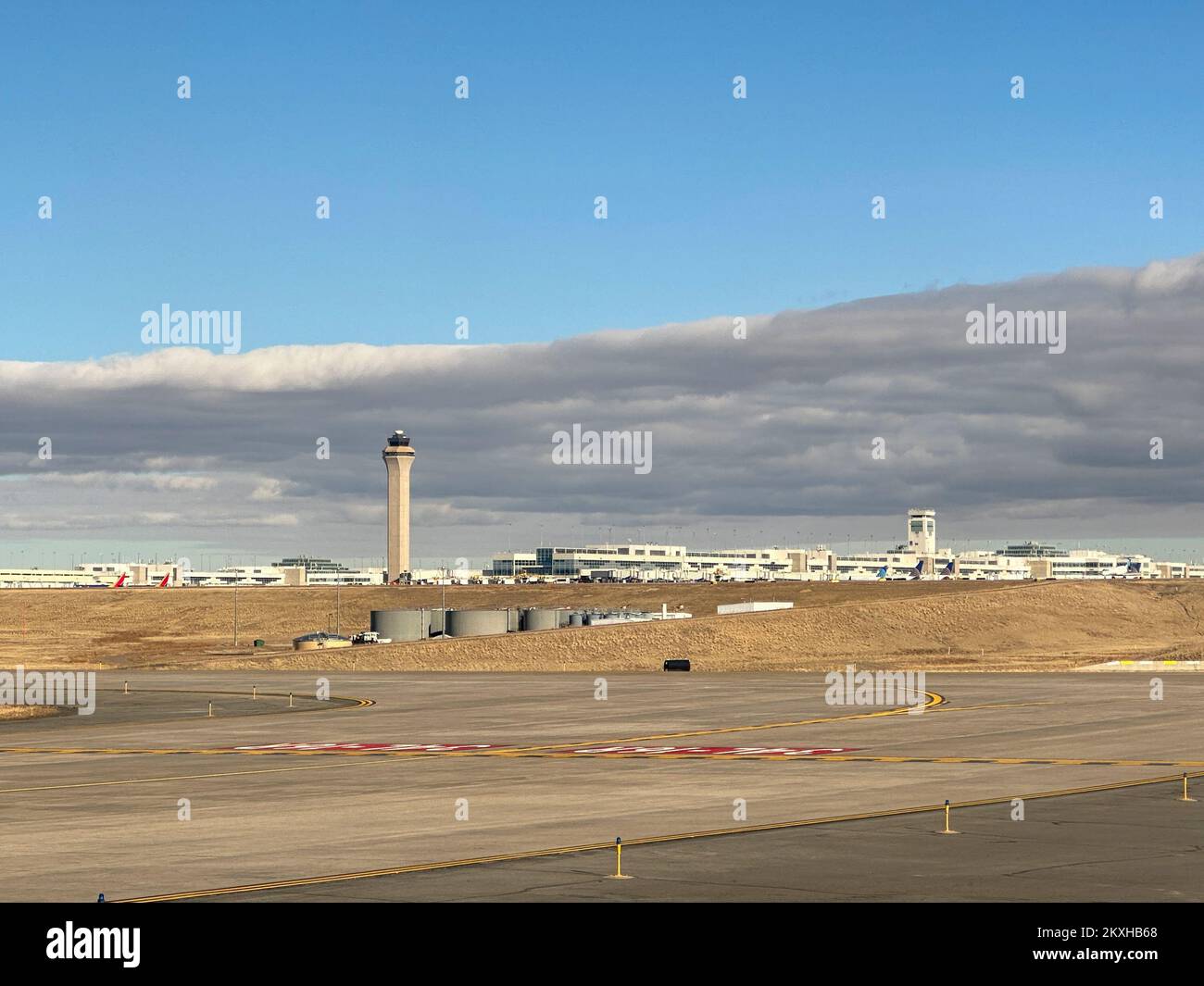 Denver International Airport Colorado USA November 24 2022 View   Denver International Airport Colorado Usa November 24 2022 View Of The Control Tower And Jeppesen Terminal From The Runway Under A Cloudy Sky 2KXHB68 