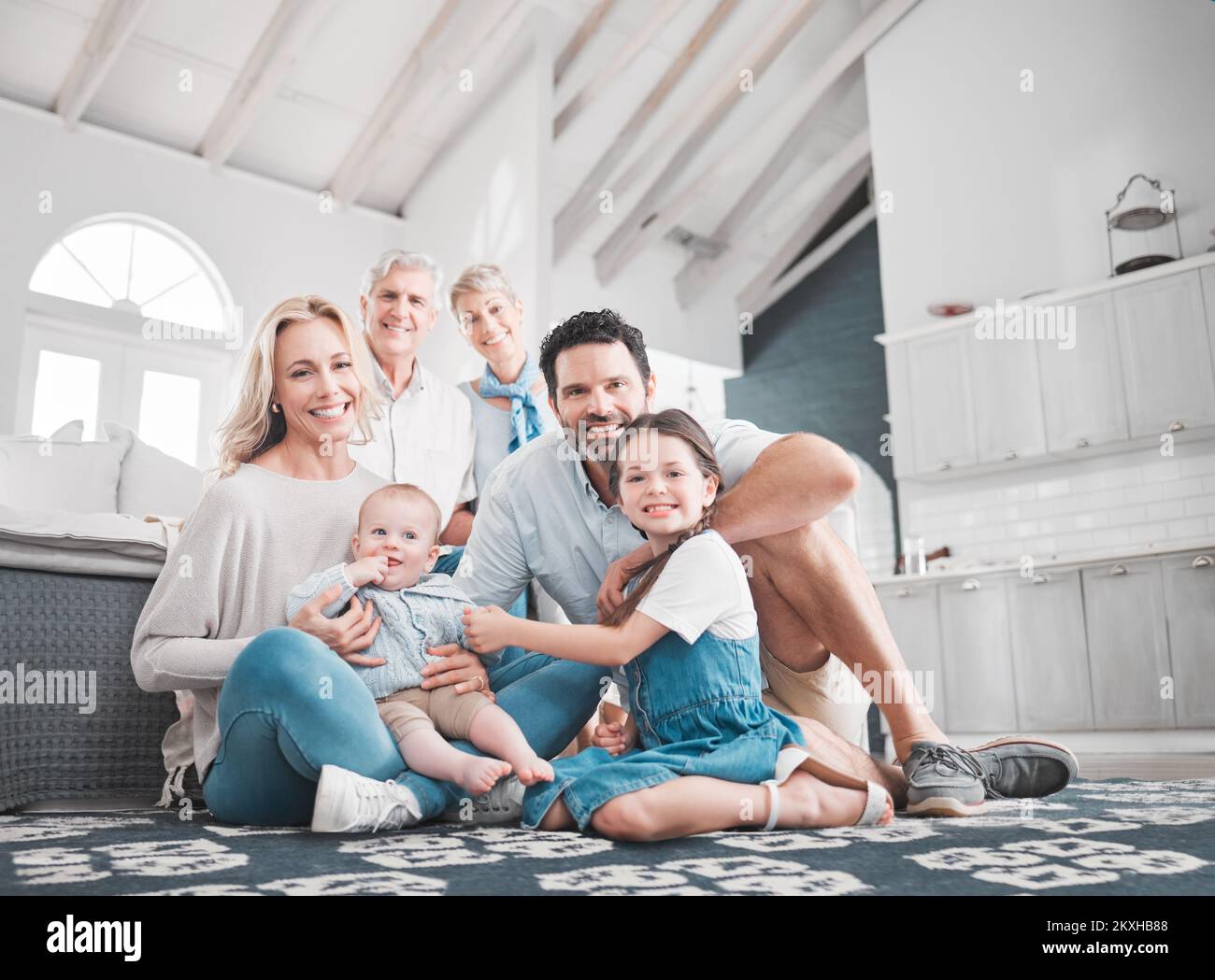 Family, love and portrait of big family relax in the family home for fun and care with mother, father and grandparents. Generations, grandfather and Stock Photo