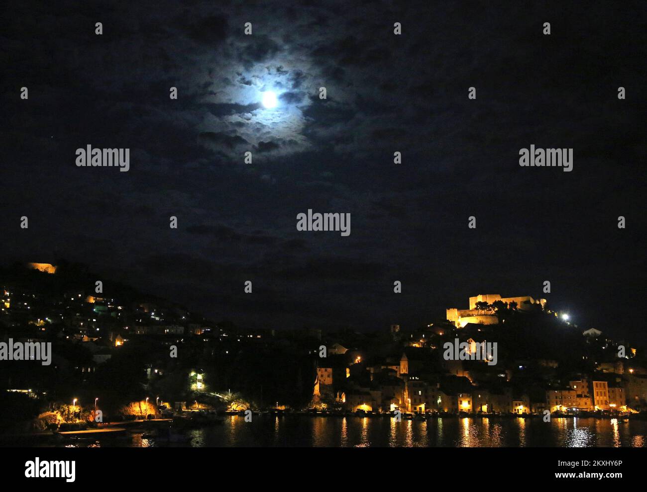 Photo taken on Oct. 1, 2020 shows the full moon above the city, in Sibenik, Croatia.A micro moon , as a contrary to a super moon, occurs when it rises at the furthest away point from the Earth.It normally appears amaller and slightly less bright.This Micro Harvest Moon will be the second asmallest of all in 2020. Photo: Dusko Jaramaz/PIXSELL  Stock Photo