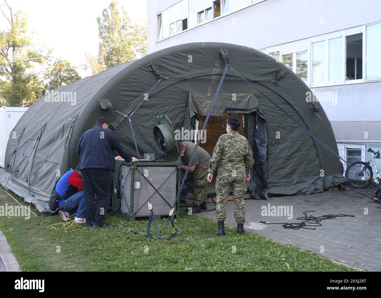 Croatian Army sets up a tent from the Expeditionary Camp for the purpose of  performing triage procedures during the coranavirus pandemic in front of  the Clinical hospital Zagreb in Zagreb, Croatia on