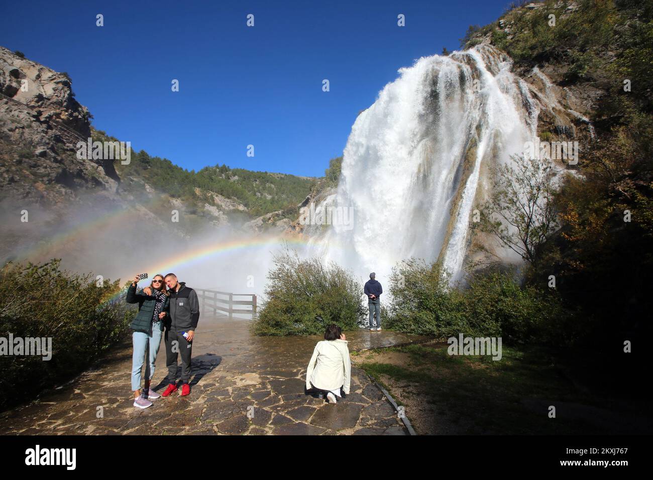 People take selfies at Krcic Waterfall, in Knin, Croatia, on October 18