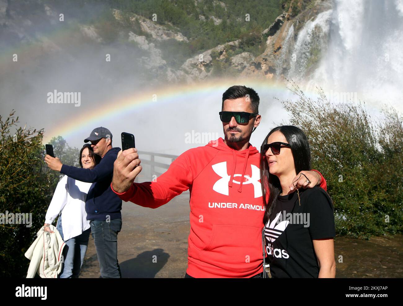 People take selfies at Krcic Waterfall, in Knin, Croatia, on October 18