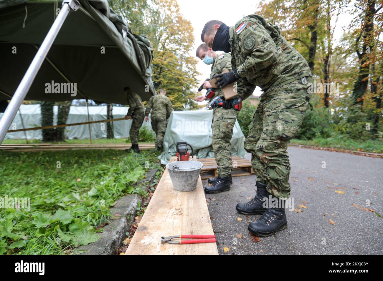 Army is setting up tents in front of The School of Medicine of the