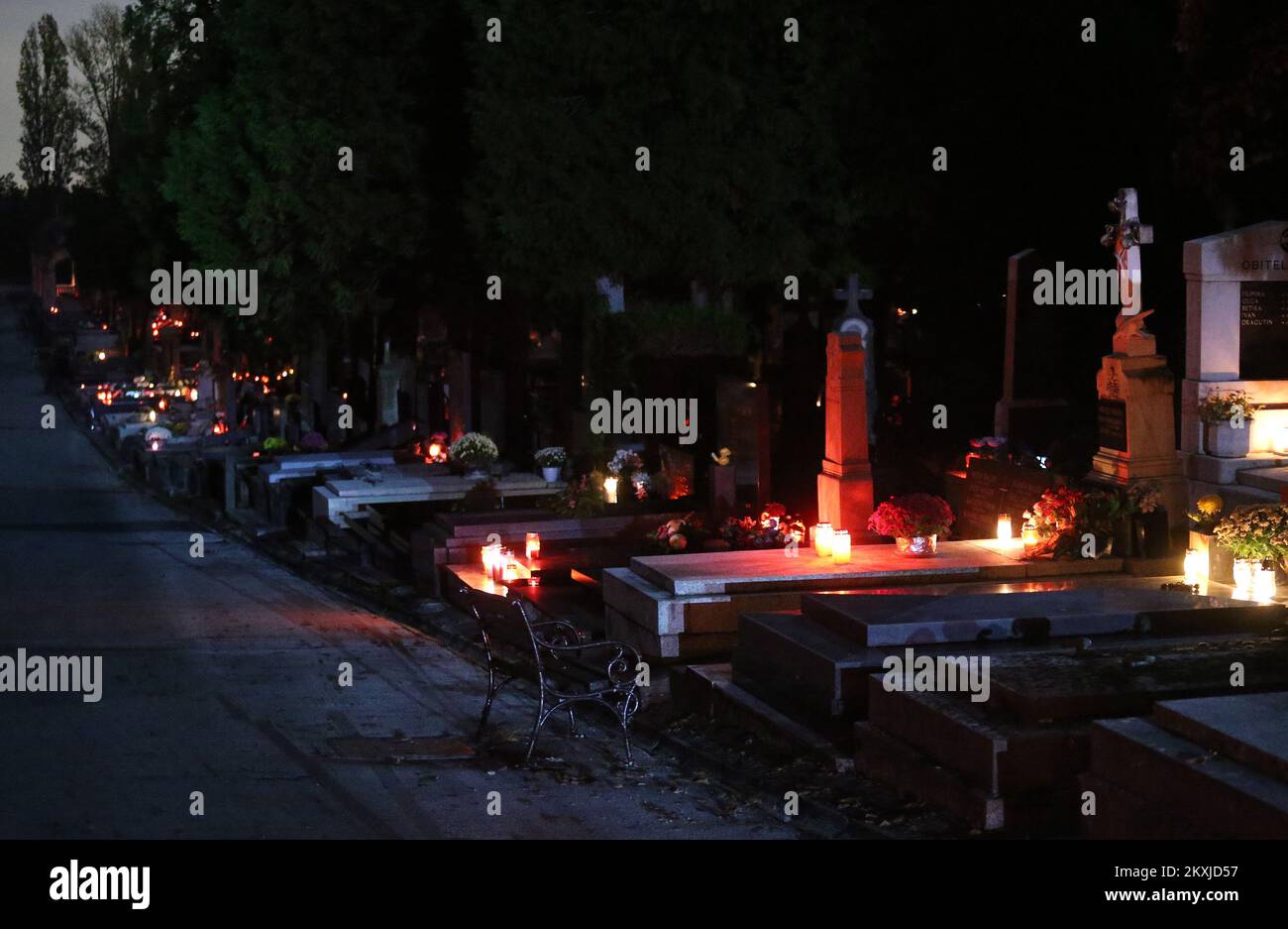 Candles and flowers on the graves at the Mirogoj cemetery before the