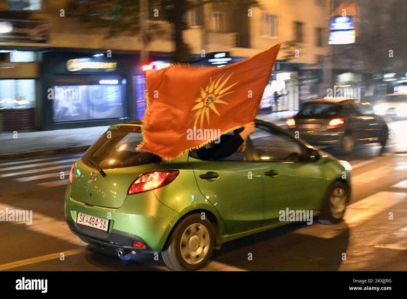 Football fans celebrate on the city streets , in Skoplje, North Macedonia , on November 12,2020.North Macedonia will go to a major tournament for the first time in their history after a Goran Pandev goal gave the Balkan nation a 1-0 win away to Georgia in their Euro 2021 qualifying play-off final on Thursday.Pandev scored the only goal of the game in the 56th minute in Tbilisi, allowing the country who sit 65th in FIFA's world rankings to secure their place in the finals of the postponed European Championship, which is now set to go ahead in June and July next year.They will go into Group C at Stock Photo