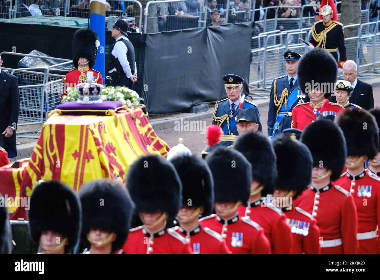 King Charles III walks behind the coffin of his mother, Majesty Queen Elizabeth II followed by his first son, William the Prince of Wales. photographed during The ceremonial procession to transport her late Majesty Queen Elizabeth II’s coffin from Buckingham Palace to the Palace of Westminster at The Mall , London on Wednesday 14 September 2022 . Picture by Julie Edwards. Stock Photo