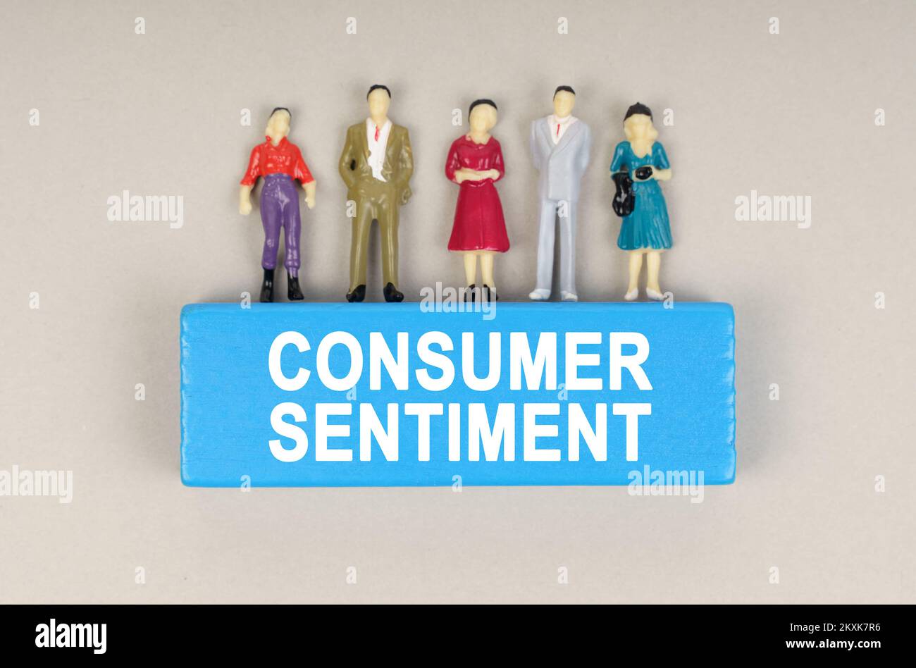 Business concept. On the blue block the inscription - Consumer Sentiment. There are figures of people on the block. Stock Photo