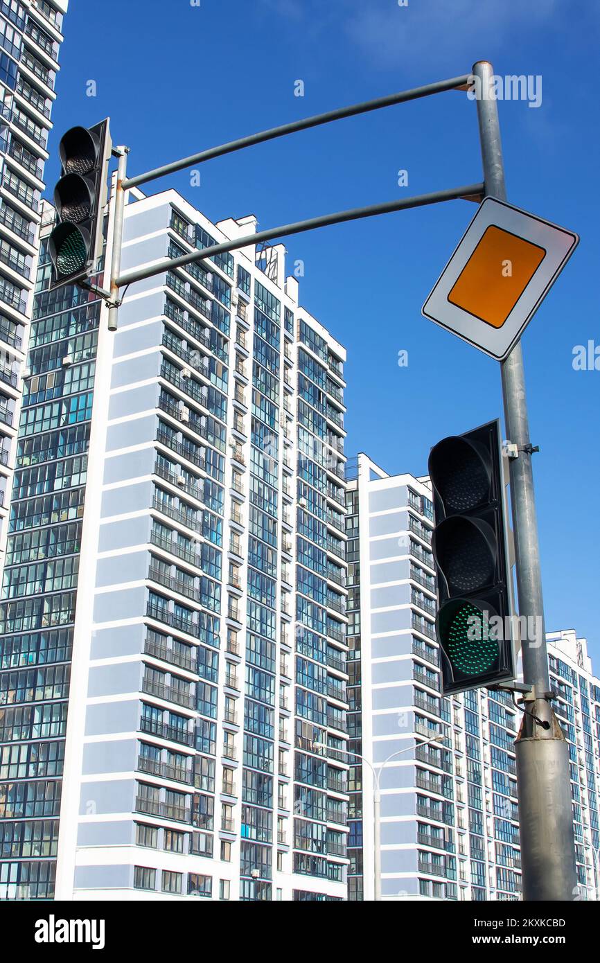 Green traffic light on the background of buildings close up Stock Photo ...