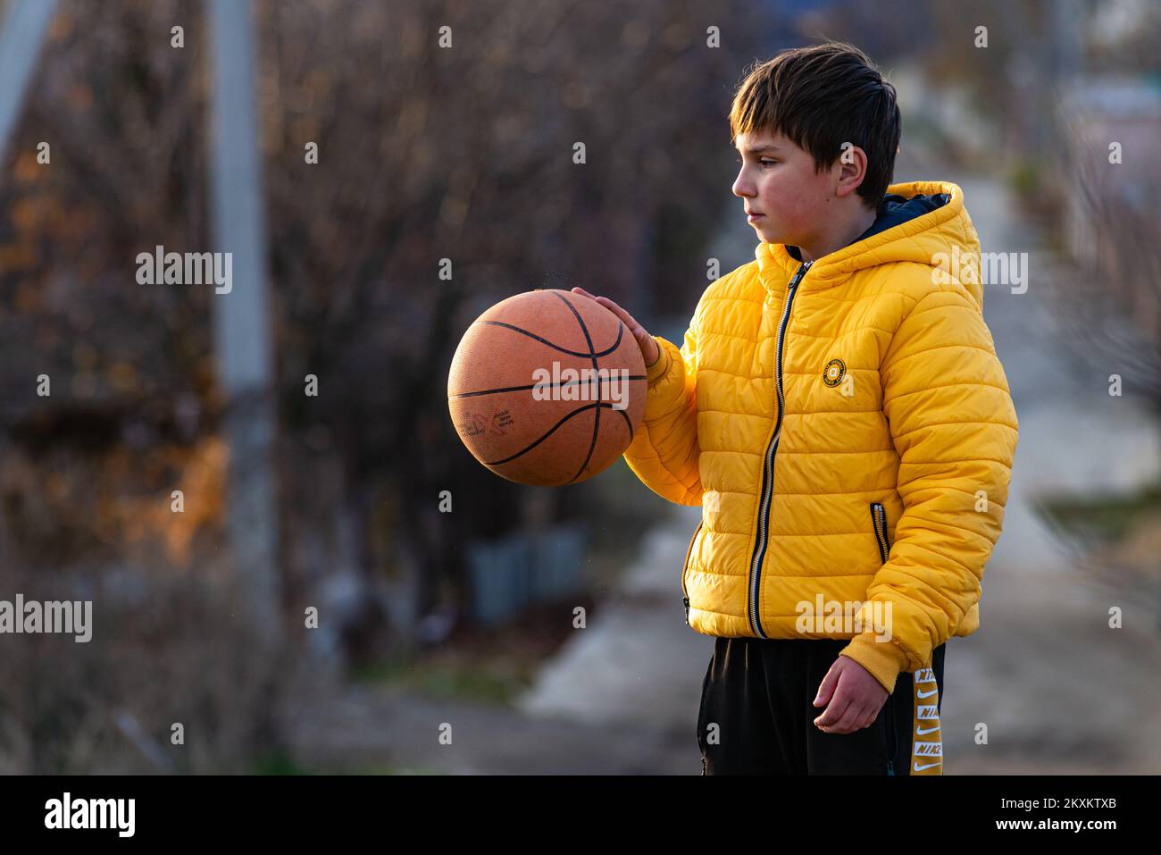 Young boy holding in hands Basketball sport Young little caucasian