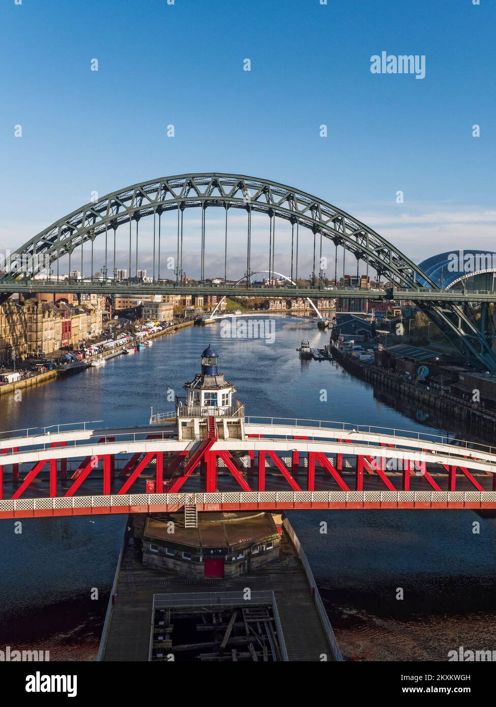 River Tyne at Newcastle, UK, with Tyne, Swing and Millennium bridges, and Sunday quayside market. Stock Photo