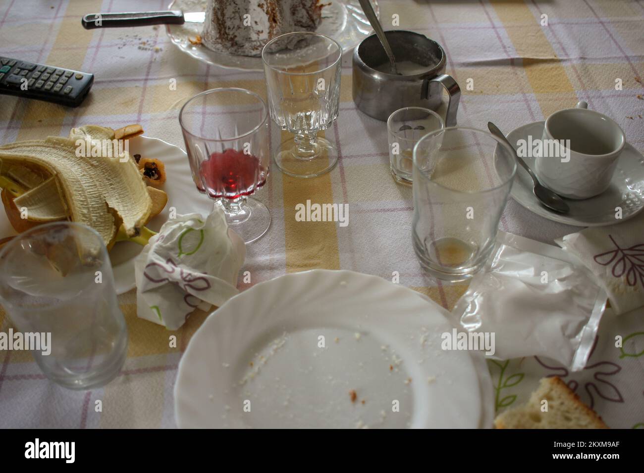 table is a mess after having lunch and having coffee Stock Photo