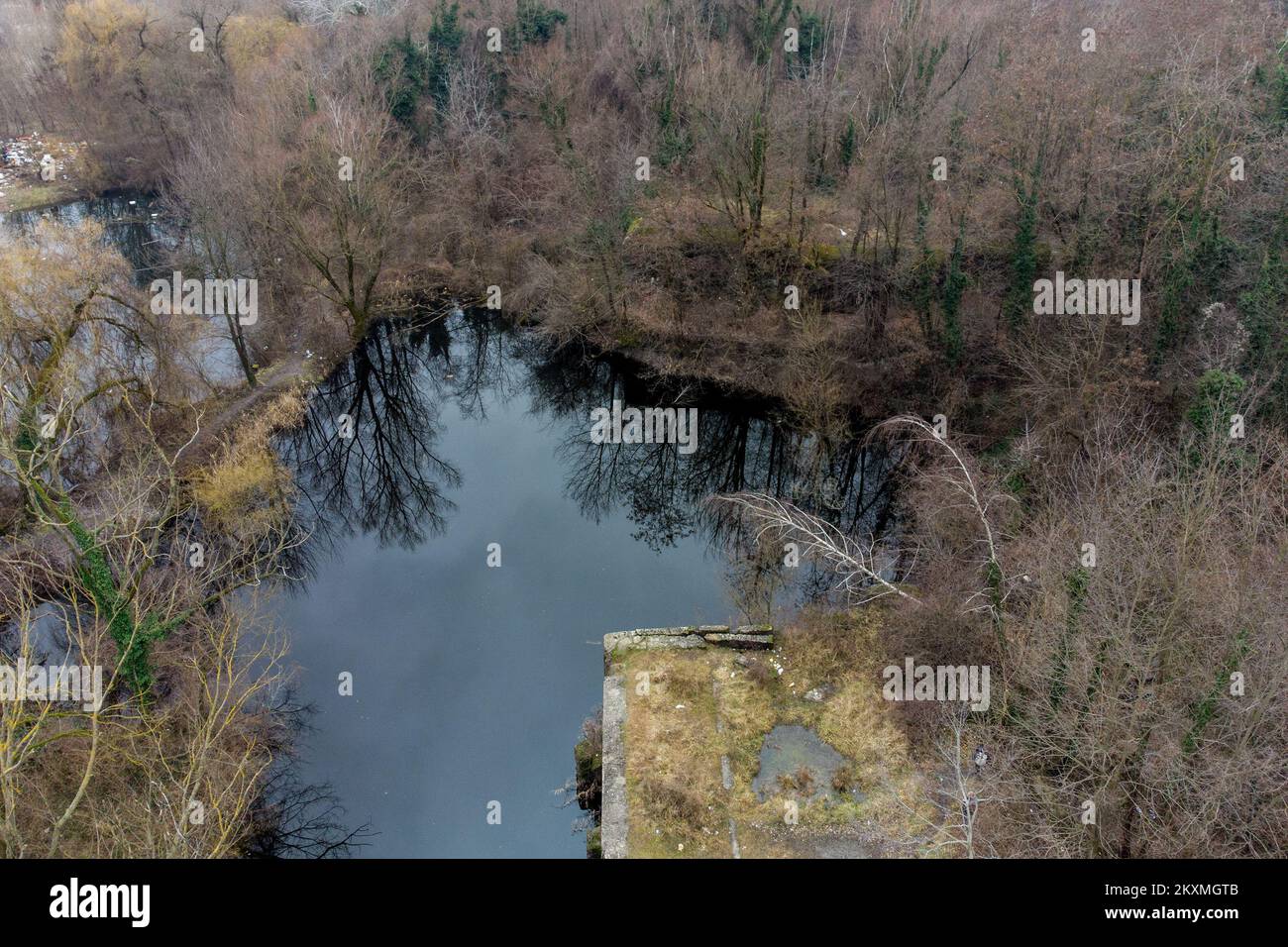 Aerial photo of one of the largest remaining German bunkers from the WW2 in Croatia, in Zagreb, Craotia, February 03, 2021. In the forest next to small lakes in the Crnomerec in Zagreb, there is one of the largest remaining German bunkers from the Second World War in Croatia. It is a Regelbau B anti-aircraft overhead bunker made of concrete and steel that was part of a complex of five bunkers near the former headquarters of the 7th SS Division Prinz Eugen. After the complex was destroyed in 1945 during the withdrawal of the German army, two bunkers remained visible and have since fallen into o Stock Photo