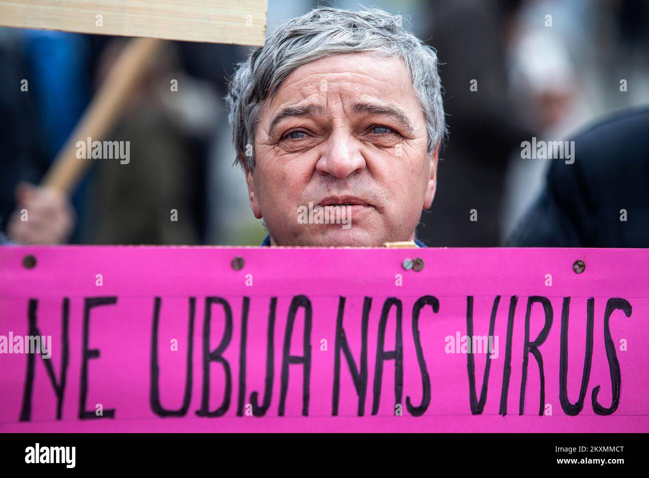 Demonstrator hold up placard during global 'World Wide Rally for Freedom' protest campaign to denounce COVID-19-related restrictions and vaccination rollout plans in Osijek, Croatia on March 20, 2021. Photo: Davor Javorovic/PIXSELL Stock Photo