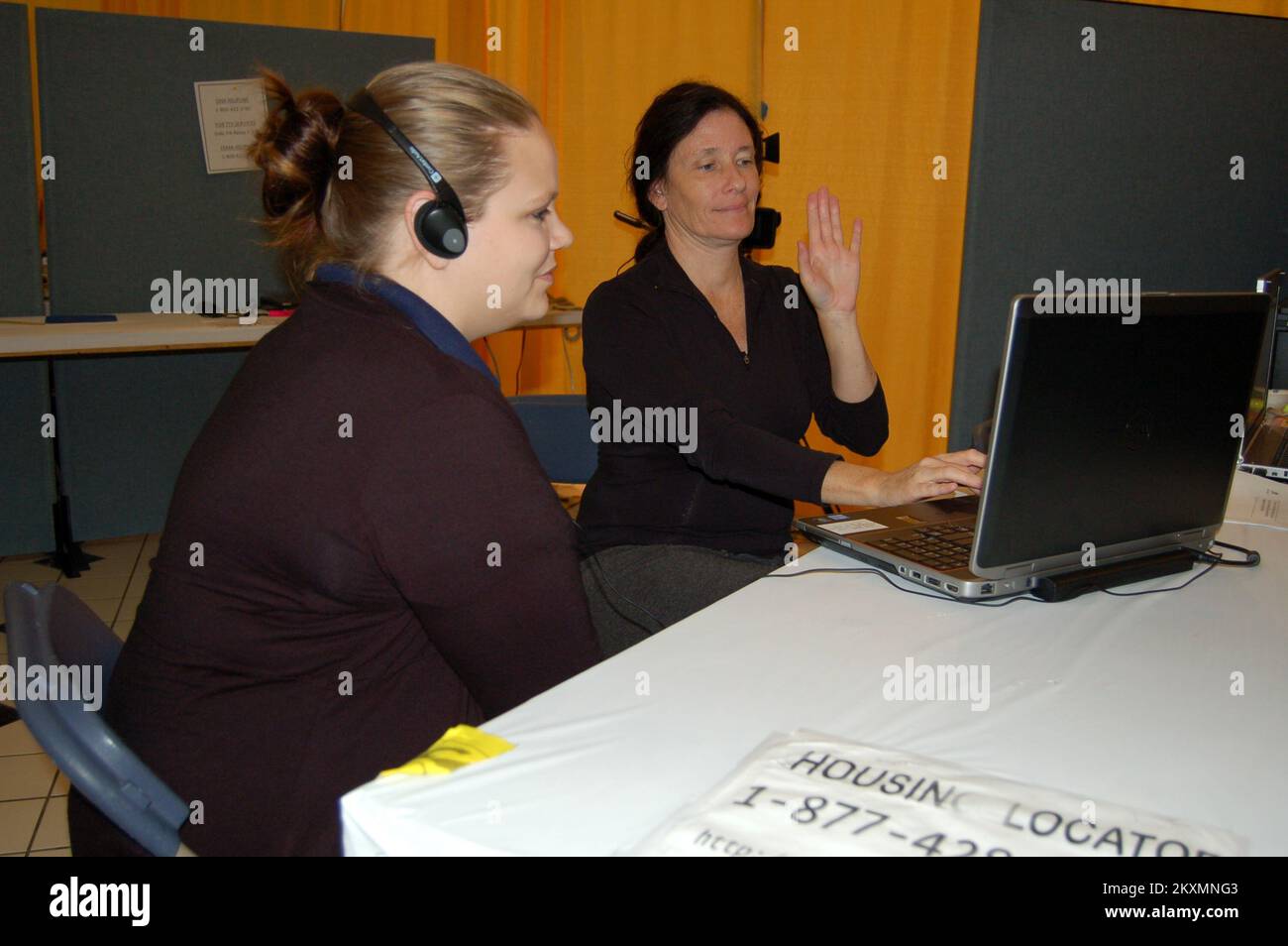 Flooding   Hurricane/Tropical Storm   Severe Storm - Harrisburg, Pa. , October 13, 2011   Debi Chrisbacker (R) ODHH/FEMA Sign Language consultant and Christell Boudreaux, FEMA Applicant Services Team Lead, demonstrate the use of Video Remote Interpreting (VRI) a new services that FEMA is offering to applicants at the Disaster Recovery Centers. Pennsylvania Tropical Storm Lee. Photographs Relating to Disasters and Emergency Management Programs, Activities, and Officials Stock Photo