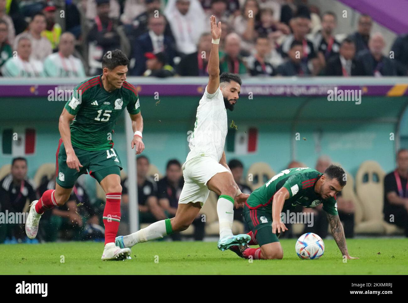 Saudi Arabia's Saleh Al-Shehri (centre) battles with Mexico's Hector Moreno (left) and Luis Chavez during the FIFA World Cup Group C match at the Lusail Stadium in Lusail, Qatar. Picture date: Wednesday November 30, 2022. Stock Photo