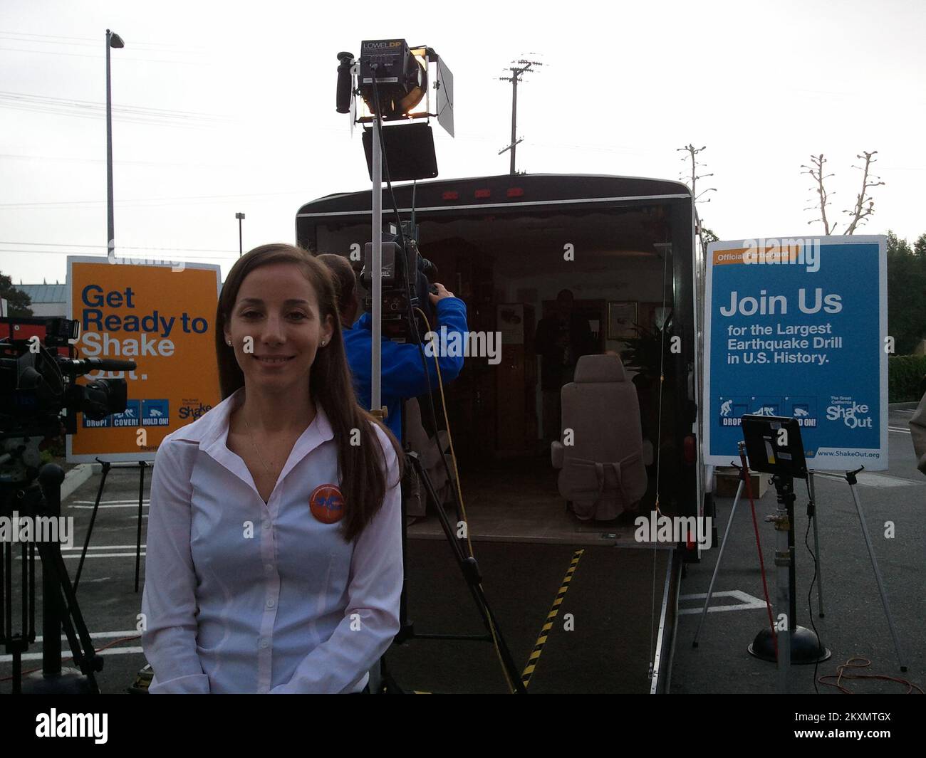 Earthquake - Northridge, Calif. , Oct. 20, 2011   FEMA Region IX Earthquake Specialist, Jennifer Lynette, in front of an earthquake simulator truck at the Great California ShakeOut media event at Target. The ShakeOut drill and press event participants included FEMA, CalEMA, LA City Council Members, USGS, SCEC, ECA, Mexican delegation, Japanese delegation, Target, and the general public... Photographs Relating to Disasters and Emergency Management Programs, Activities, and Officials Stock Photo