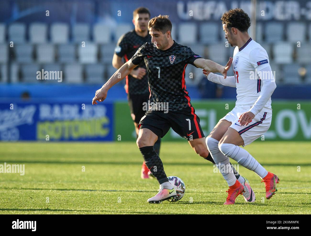 KOPER, SLOVENIA - MARCH 31: Luka Ivanusec of Croatia and Curtis Jones of England battle for the ball during the 2021 UEFA European Under-21 Championship Group D match between Croatia and England at Bonifika Stadium on March 31, 2021 in Koper, Slovenia. Photo: Marko Lukunic/PIXSELL Stock Photo