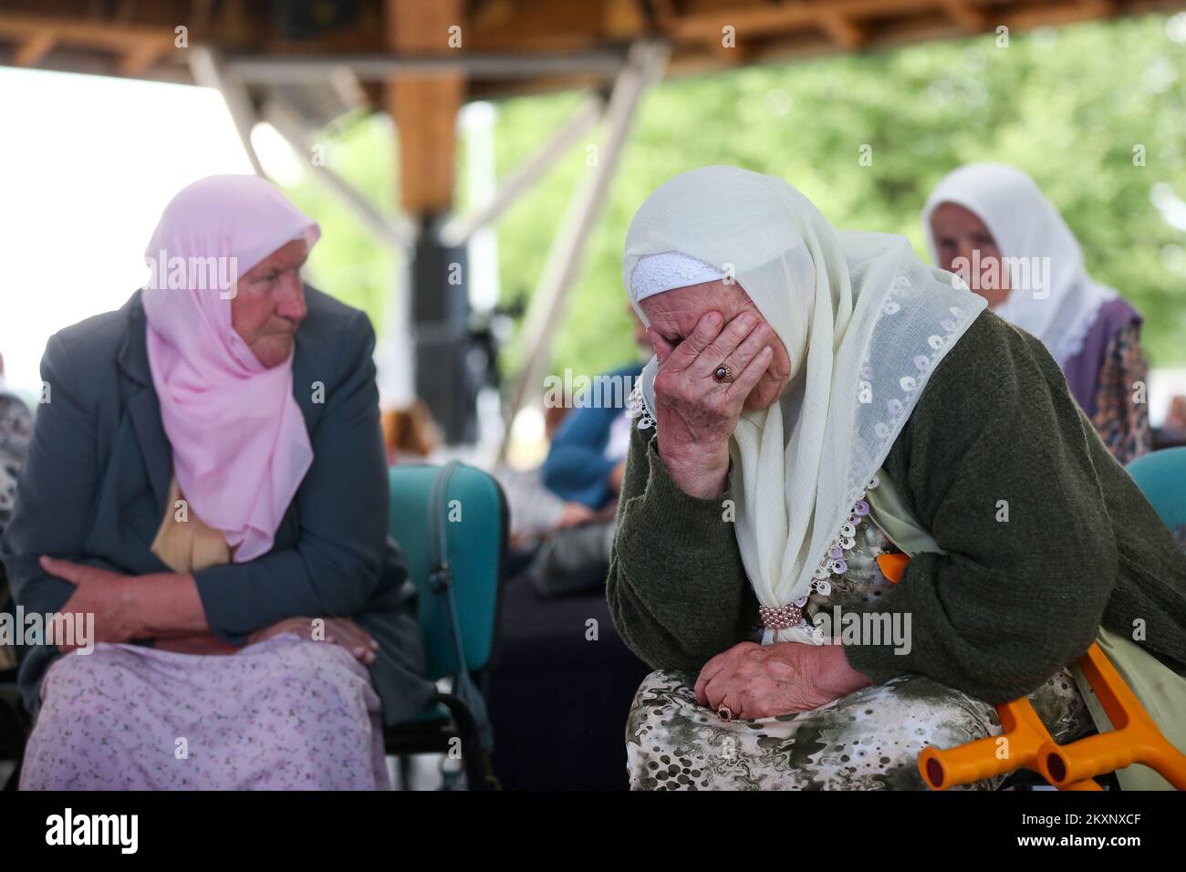 Mothers of Srebrenica follow the verdict against Ratko Mladic, in Potocari, Bosnia and Herzegovina ,on June 8, 2021 .The commander, the Bosnian Serb former general Ratko Mladic, was convicted in 2017 of genocide, crimes against humanity and war crimes. He was sentenced to life in prison. On Tuesday, that verdict was upheld by the International Criminal Tribunal for the Former Yugoslavia in The Hague, drawing a close to one of the darkest chapters in modern European history and ending a legal struggle that stretched back to 1995, when Mr. Mladic was first indicted.Now 79, Mr. Mladic has always Stock Photo