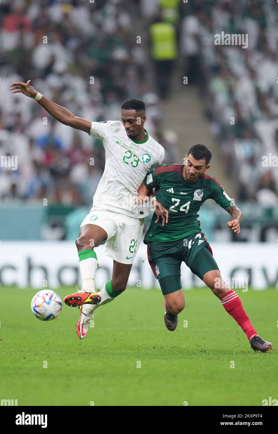 Lusail, Qatar. 30th Nov, 2022. Mohamed Kanno (L) of Saudi Arabia vies with Luis Chavez of Mexico during the Group C match between Saudi Arabia and Mexico at the 2022 FIFA World Cup at Lusail Stadium in Lusail, Qatar, Nov. 30, 2022. Credit: Meng Dingbo/Xinhua/Alamy Live News Stock Photo