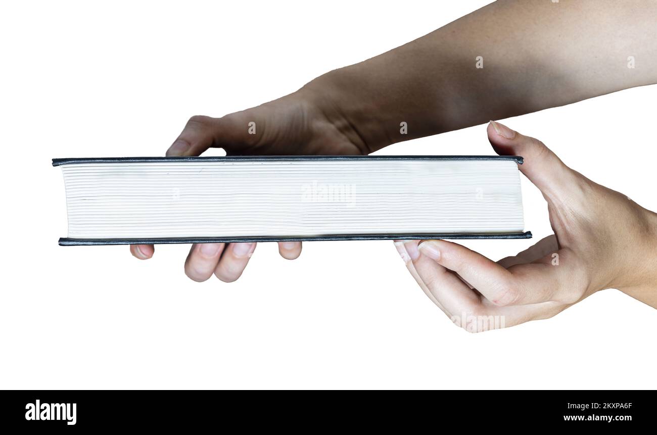 a closed book in the woman's hands Stock Photo