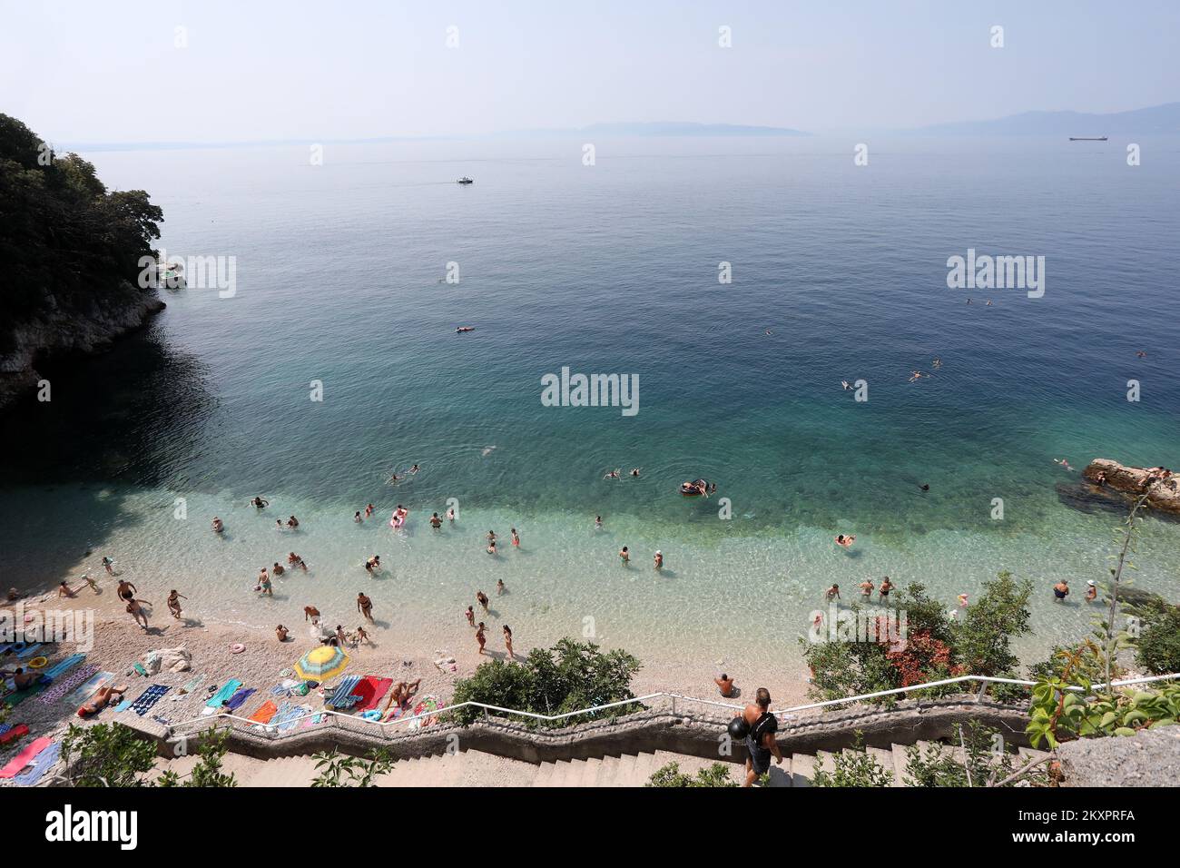 Swimmers enjoy in Sablicevo beach in Rijeka on July 24, 2021. Sablicevo ...