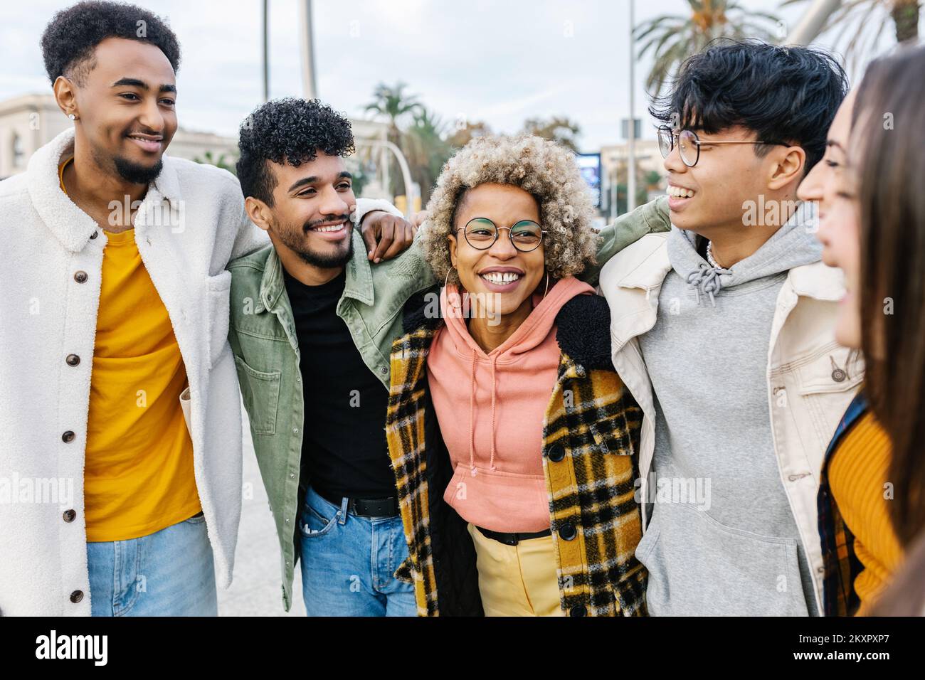 Multiracial young friends having fun in city street Stock Photo