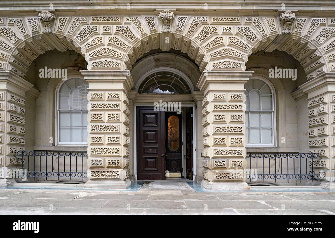 Front door of historic courthouse, Osgoode Hall in Toronto, with carved stone arches Stock Photo