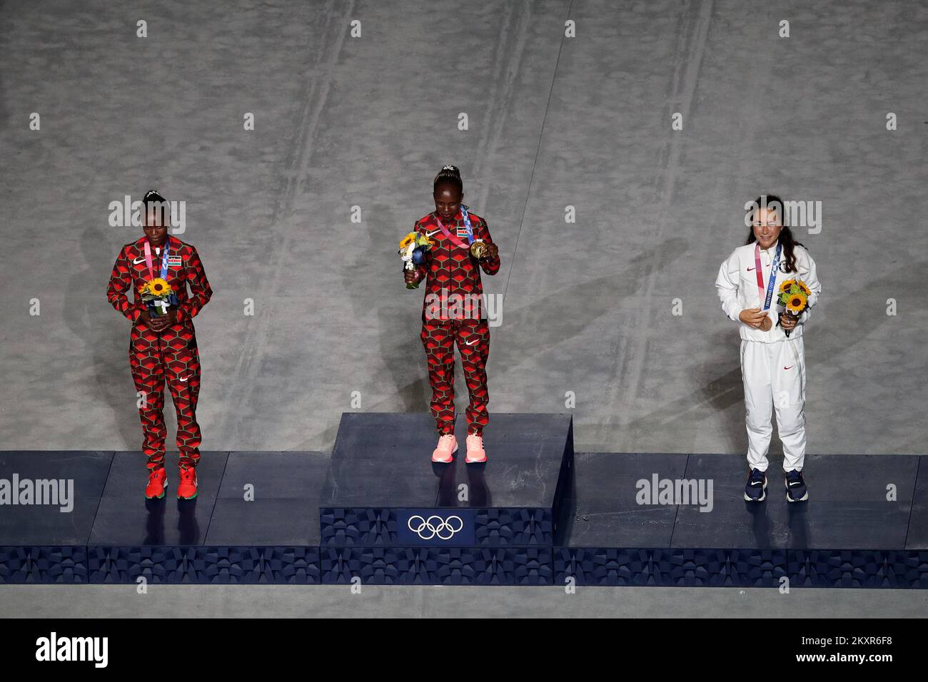 Silver medalist Brigid Kosgei of Team Kenya, gold medalist Peres