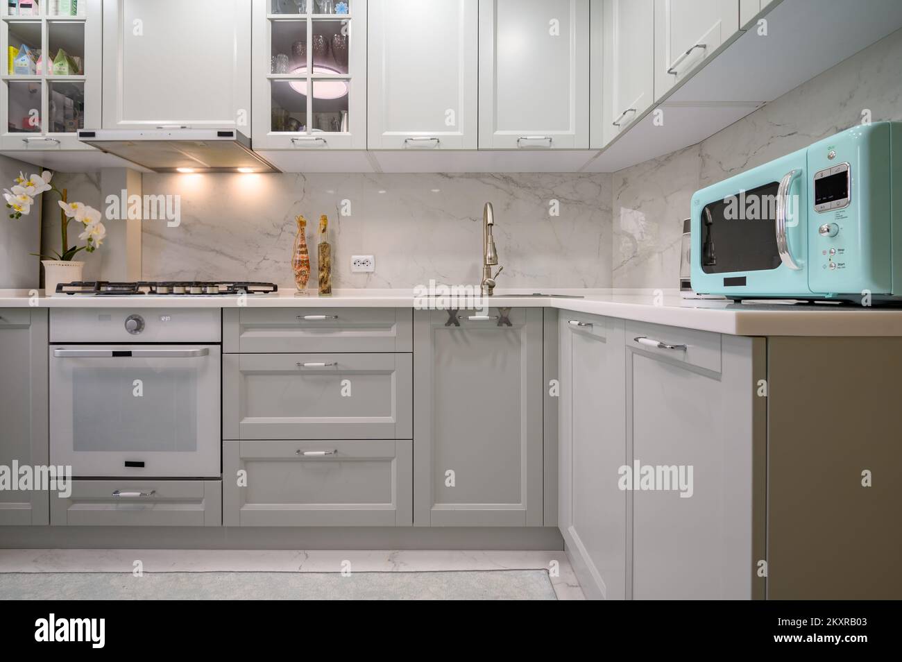New light grey modern well designed kitchen interior, front view Stock ...