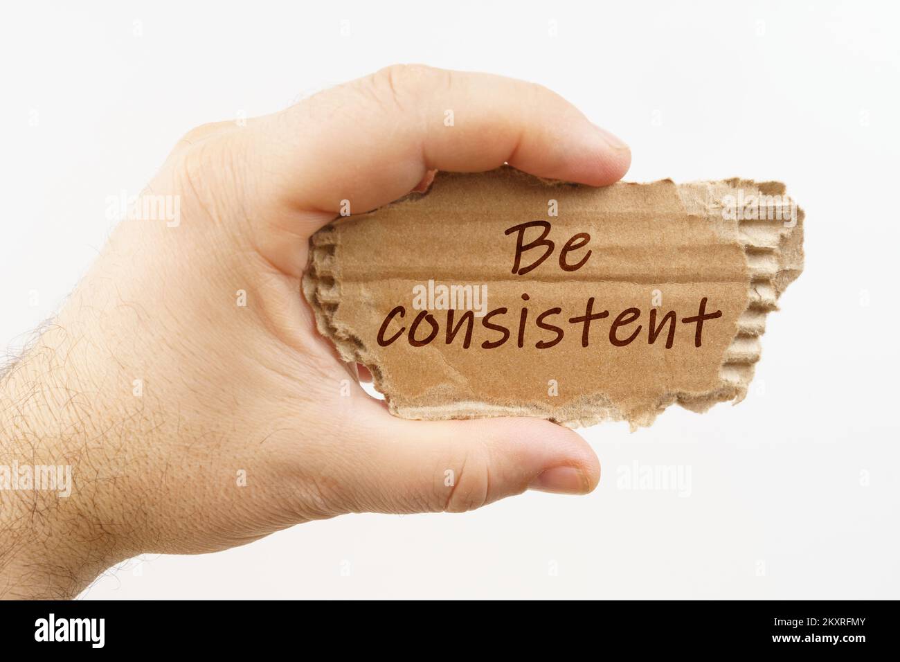 Business and finance. A man holds a cardboard in his hand on which it ...