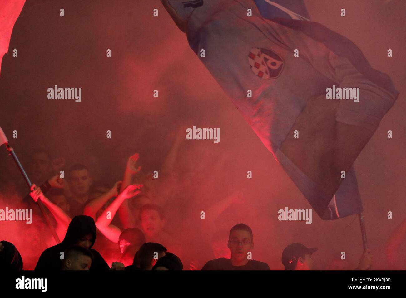 Fans of Dinamo Zagreb lite up a flares during the UEFA Champions League Play-Offs Leg Two match between Dinamo Zagreb and FC Sheriff at Maksimir Stadium on August 25, 2021 in Zagreb, Croatia. Photo: Slavko Midzor/Pixsell Stock Photo