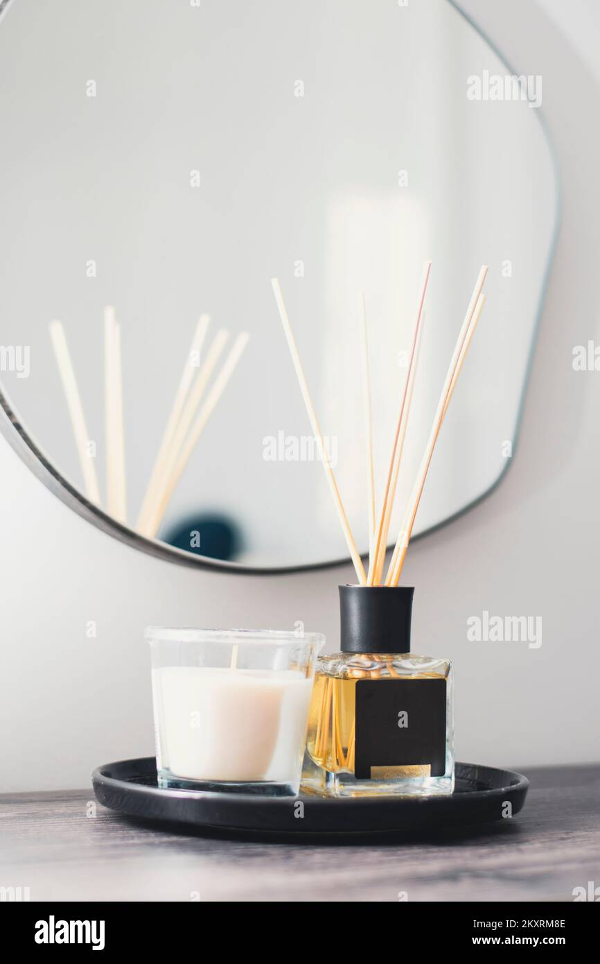 candle and fragrance accessories on the console in the living room of