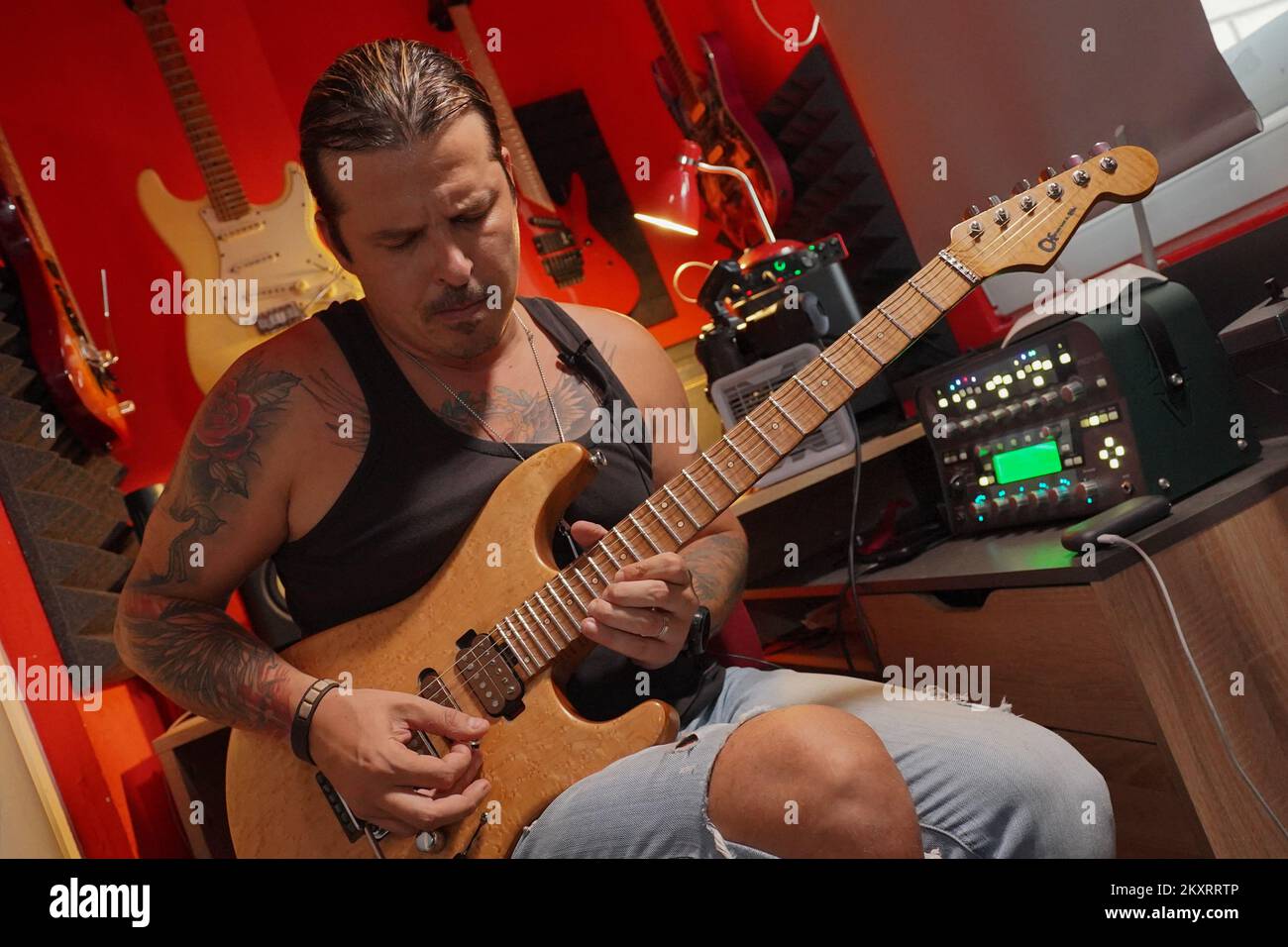 The best guitarist in the world Igor Paspalj plays guitar in a studio in Banja Luka Bosnia and Herzegovina on September 9 2021. Igor Paspalj was named the best guitarist in the