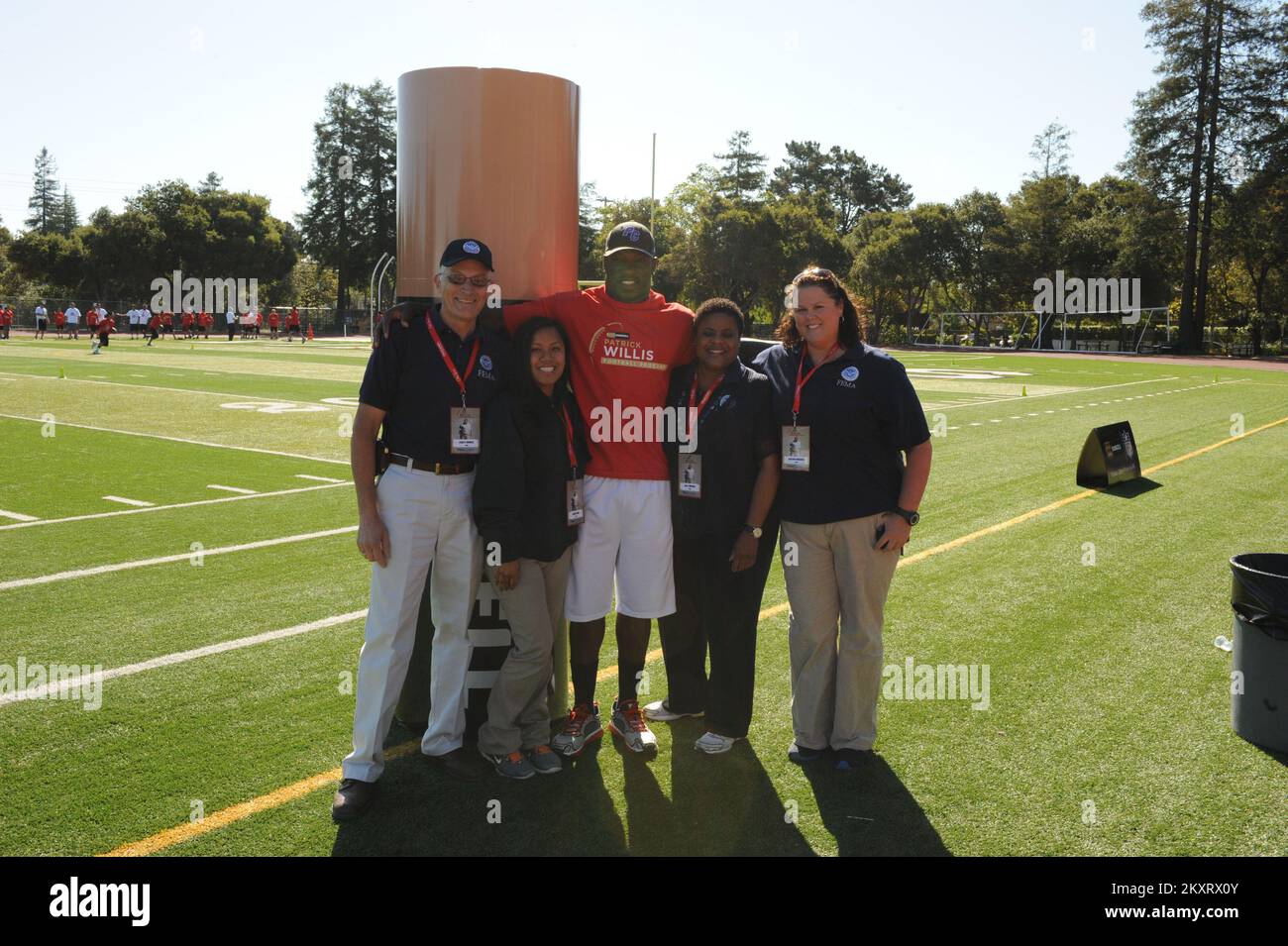 Palo Alto, Calif., June 9, 2012   Professional football player Patrick Willis with FEMA Region 9 Farley Howell, Angela Nak, Kelly Hudson, and Heather Duschell at the Duracell Patrick Willis Youth Pro-Camp.. Photographs Relating to Disasters and Emergency Management Programs, Activities, and Officials Stock Photo
