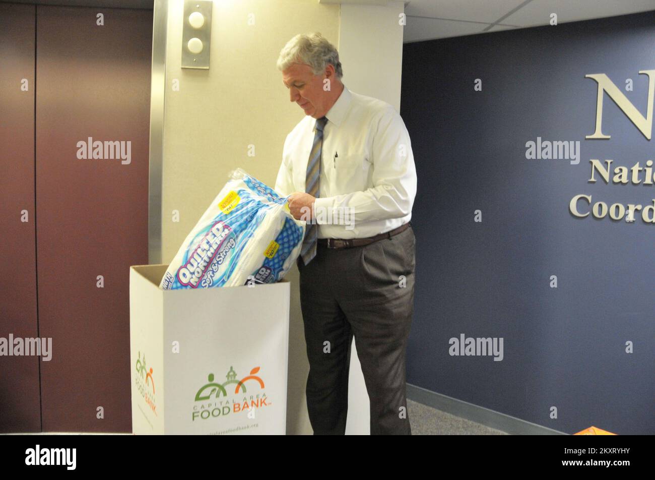 Washington, D. C. , June 26, 2012   Deputy Administrator Rich Serino makes a donation for the Feds Feed Families campaign kick off. FEMA Photo.. Photographs Relating to Disasters and Emergency Management Programs, Activities, and Officials Stock Photo