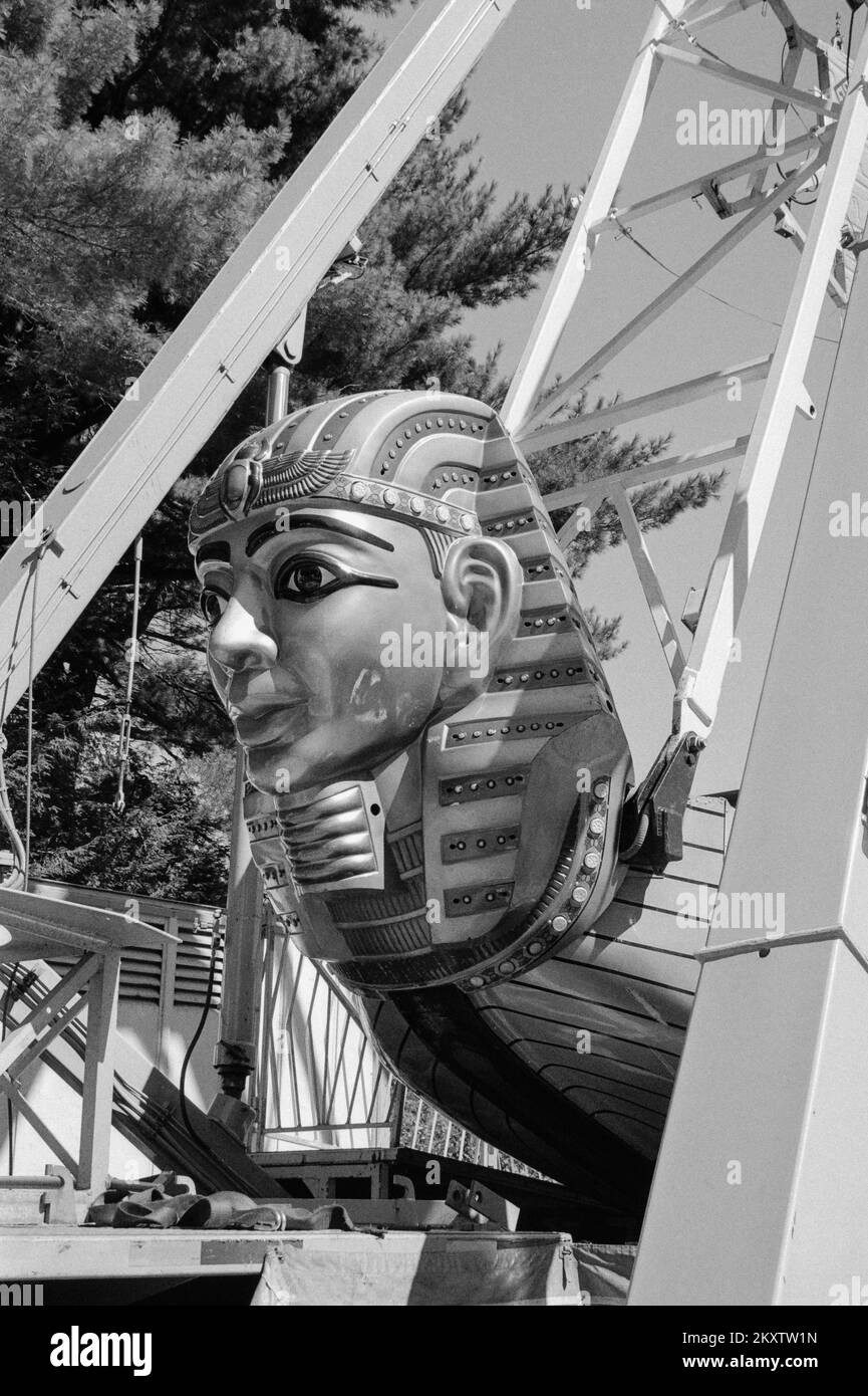 A carnival ride named the Pharaoh's Fury at the Hopkinton Fair. Hopkinton New Hampshire. The image was captured on analog black and white film. Stock Photo