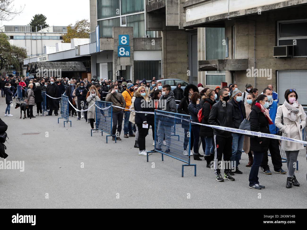 Citizens are seen waiting in lines at the Zagreb Fair for vaccination with the 1st and 2nd dose of the vaccine. The official confirmation of the headquarters has arrived that today is the day with the most deaths from coronavirus, as well as the largest number of infected people since the beginning of the pandemic. In the last 24 hours, 7,094 new cases of SARS-CoV-2 virus infection were recorded, and the number of active cases in Croatia today is a total of 31,689. Among them, 1,786 patients are in hospital treatment, of which 234 patients are on respirators., in Zagreb, Croatia, on November 0 Stock Photo