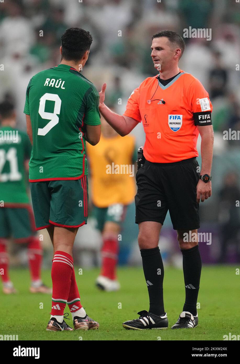 Match referee Michael Oliver shows his watch to Mexico's Raul Jimenez at full-time after the FIFA World Cup Group C match at the Lusail Stadium in Lusail, Qatar. Picture date: Wednesday November 30, 2022. Stock Photo