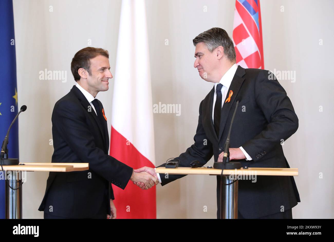 President of Croatia Zoran Milanovic and President of France Emmanuel Macron wearing orange ribbons on the occasion of the International Day for the Elimination of Violence against Women give a statement after the meeting at the Office of the President, in Zagreb, Croatia, on November 25, 2021. Photo: Sanjin Strukic/PIXSELL Stock Photo