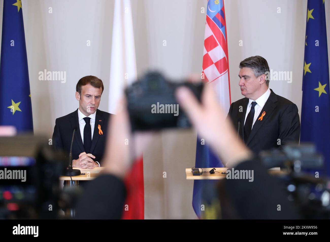 President of Croatia Zoran Milanovic and President of France Emmanuel Macron wearing orange ribbons on the occasion of the International Day for the Elimination of Violence against Women give a statement after the meeting at the Office of the President, in Zagreb, Croatia, on November 25, 2021. Photo: Sanjin Strukic/PIXSELL Stock Photo